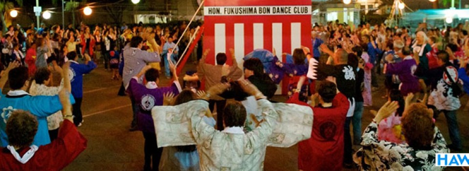 Bon dancers and yagura platform