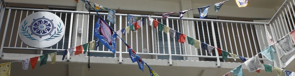 PBA logo with flags in courtyard