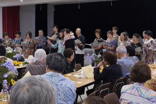 Betsuin choir with seated guests in the foreground