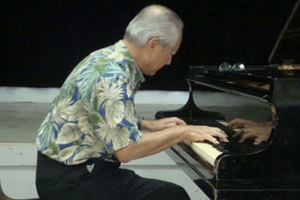 a man plays the piano