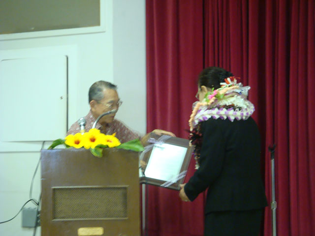 Presentation of plaque to Mrs. Saito