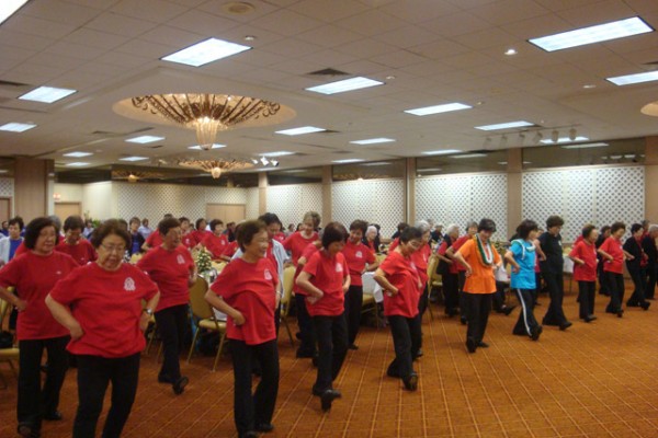 Recreational Dances - dancers with red t-shirts in a ballroom