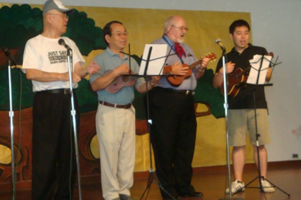 ministers on stage with ukeleles