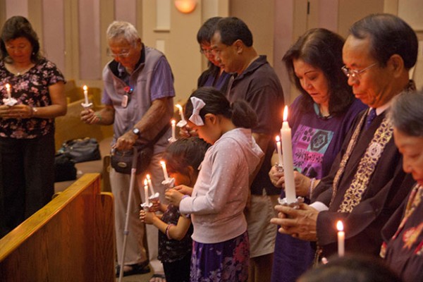 holding candles at the 2014 Gotan-e evening service