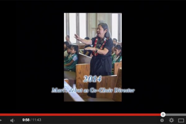 video still - Ruth Tokumi video featuring Mari Murakami directing the choir