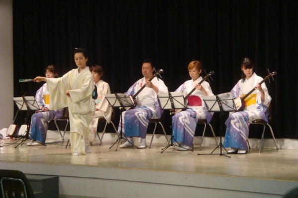 Shamisen players and dancer on Social Hall stage