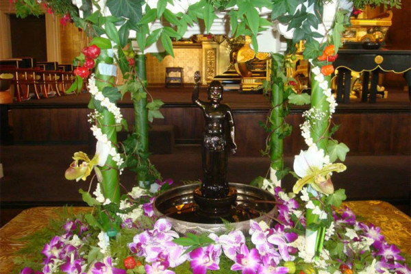 Hanamido - baby Buddha in a flower adorned shrine