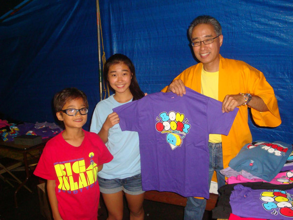 Bishop Matsumoto & children help with t-shirt sales