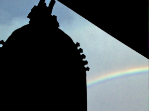 Shadow of the kansho bell with a rainbow in the background