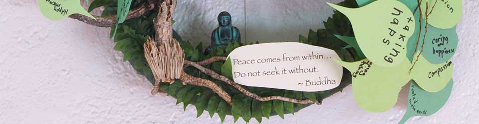 wreath detail including quote, "Peace comes from within. Do not seek it without." - Buddha