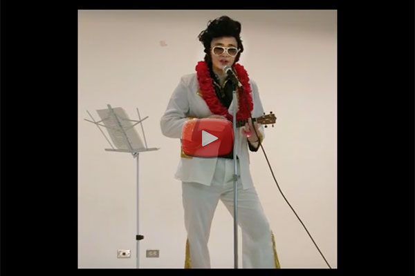 video still of "Elvis Sensei" on stage at Betsuin social hall