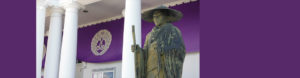 Shinran Shonin statue with purple banner