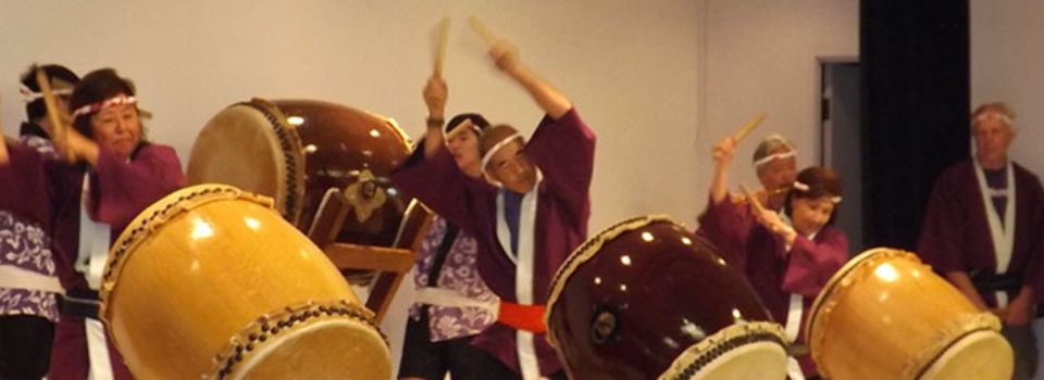 taiko players and drums in action on Social Hall stage