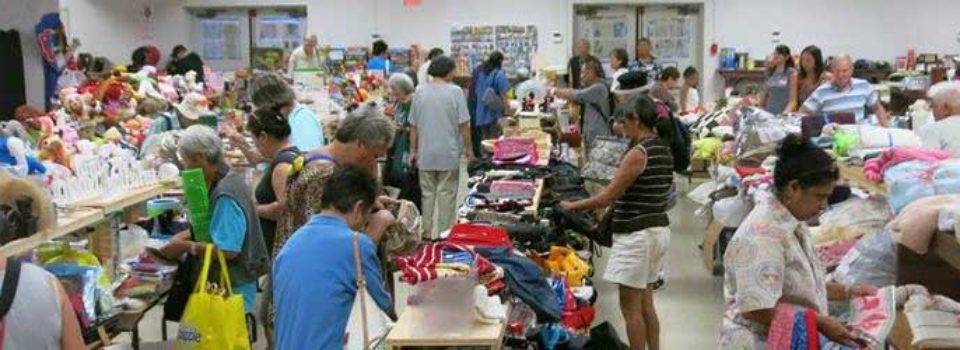 social hall filled with rummage sale and shoppers