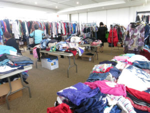 racks and tables of clothes in the Annex Temple for 2018 Bazaar