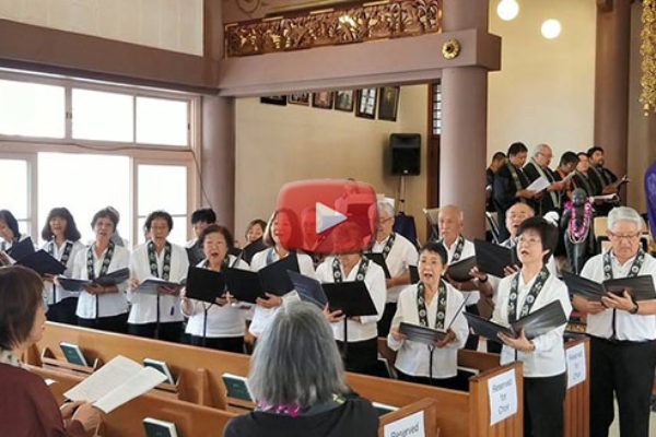 Hawaii Betsuin Choir at Soto Mission with Mari Murakami in the foreground and YouTube play button