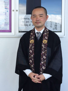 Reverend Shingo Furusawa outside the hondo