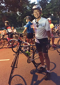 Arthur Nakagawa next to his bike