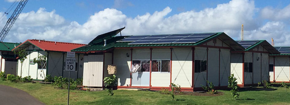 Kahauiki Village homes with solar panels as seen from entrance