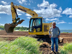 Russell Yamamoto with an excavator