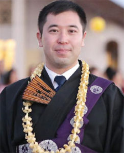 Rev. Tomo Hojo with lei and fan