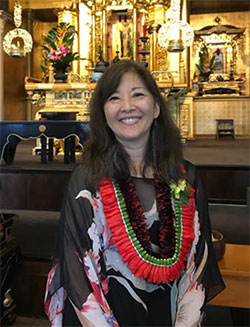 Penny Atcheson wearing lei at Bodhi Day Service 2018