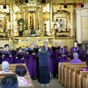 Hawaii Betsuin Choir sings "Flying Free" - in purple gowns before the altar with Choir Director Mari Murakami directing