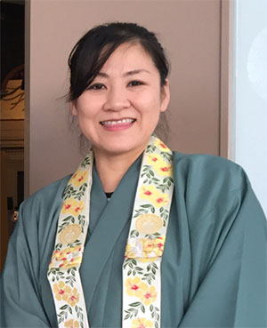 Rev. Hasebe in robes outside hondo at Bon Dance 2018