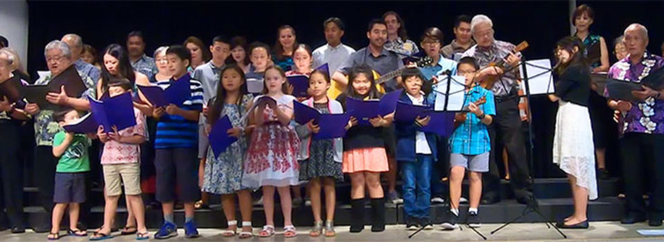 combined Betsuin Choir and Dharma School Ohana on stage singing