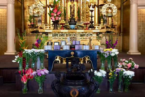 Hawaii Betsuin altar at Hatsubon, with flowers and family record books