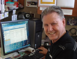 Stan Michaels at desk computer