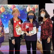 BWA year-end party video - 5 women in front of holiday backdrop, two displaying cookies