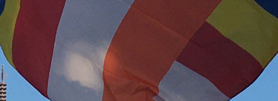 closeup of Buddhist flag flying at Hawaii Betsuin