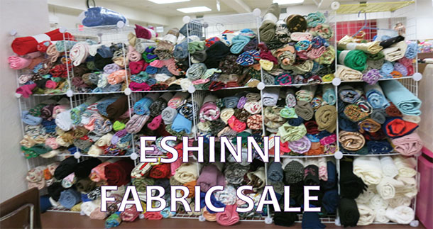 Eshinni Fabric Sale - display racks with scores of fabric lengths for sale