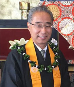 Bishop Eric Matsumoto with kukui nut lei
