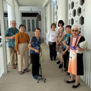 Group with Rev. Irene Nakamoto (wearing lei) in the corridor by the kansho