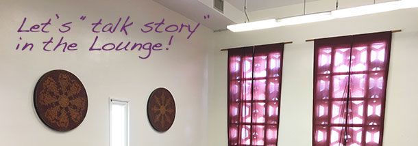 backlit purple curtains in the Lounge with "Let's talk story..."