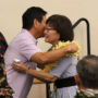 Hawai‘i Betsuin’s Jon Matsuoka presents Marsha Aizumi with a lei (Kagirinaki Ai to Jihi, 10/25/24)