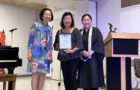 Debbie holds the Ashoka Award presented to her and Alan with Cindy and Rev. Hasebe (2025 New Year’s Party)