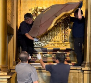 men remove the roof of a shrine in the Hawaii Betsuin altar